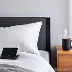 스마트홈 기기와 빅데이터의 활용 사례 - **Prompt:** A cozy, modern bedroom bathed in soft, warm light as a person (age 20s-30s, wearing comf...